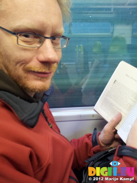 20120102_121835 Marijn reading in the train